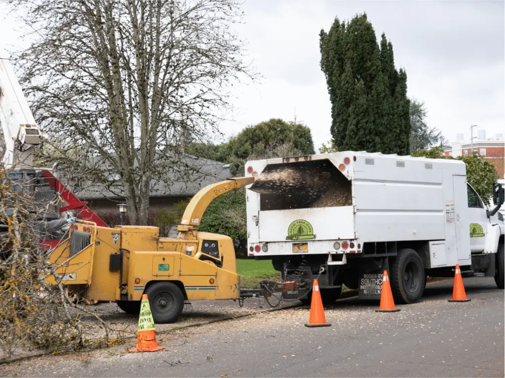 Tree service truck and chipper
